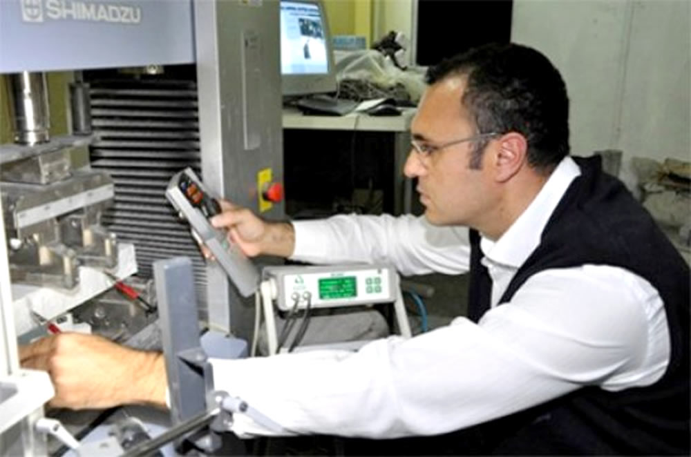 Dr. Sahmaran tests the performance of healed ECC specimen under mechanical loading.