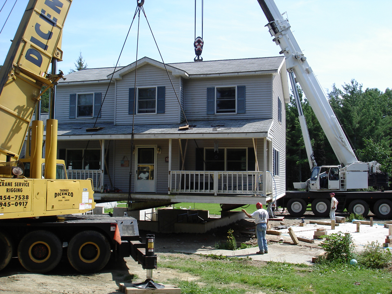 Crane pulling house up