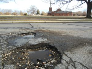 Large Pothole in Concrete Road