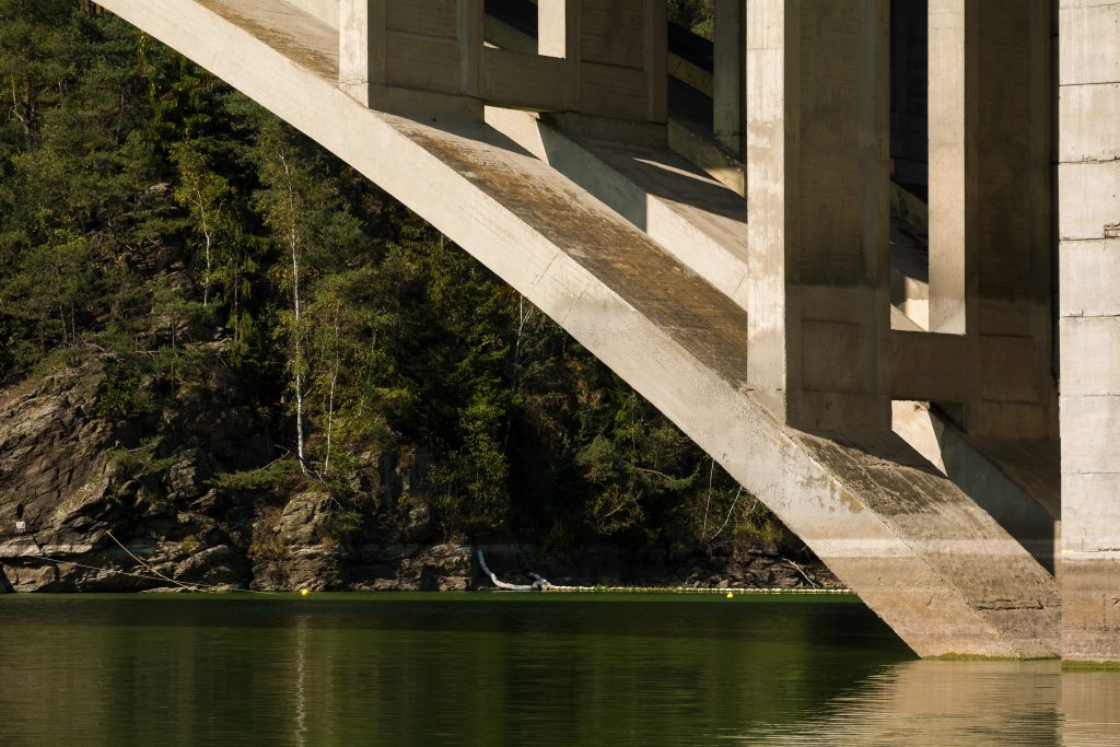 concrete bridge above lake