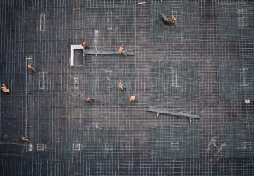 Aerial image of construction workers on rebar