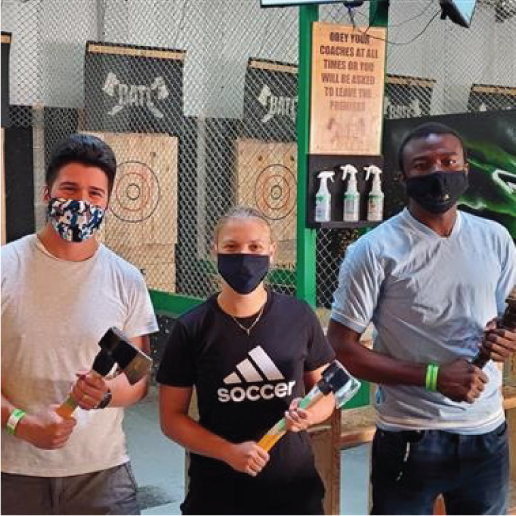 Giatec employees axe throwing while wearing masks
