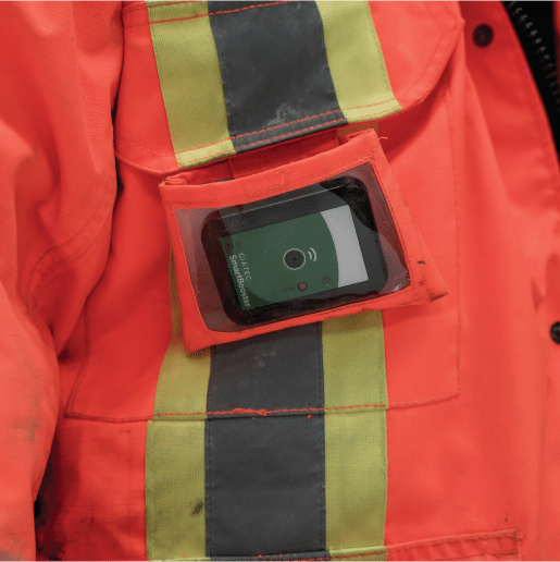 Giatec SmartBooster in a construction worker's jacket