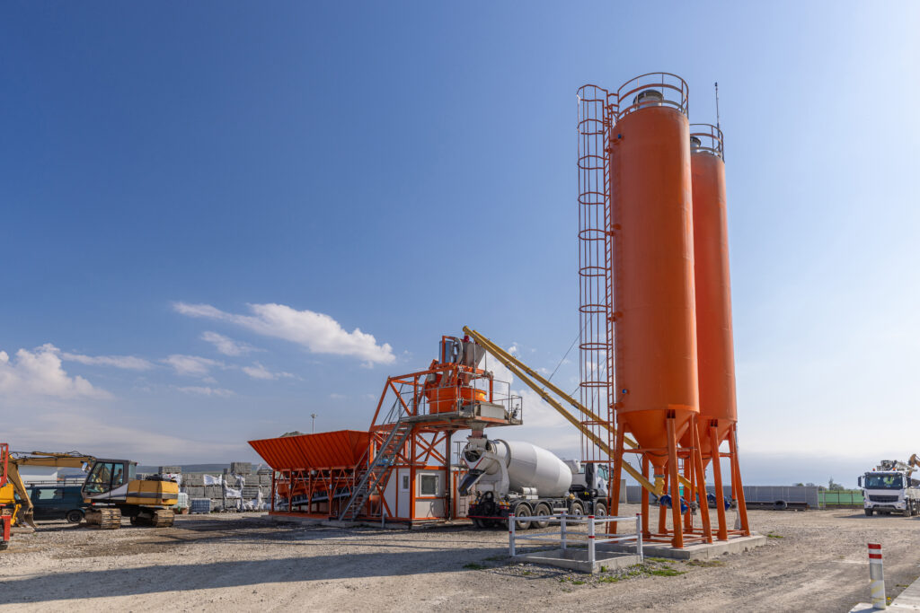 Concrete mixing plant preparing concrete for construction project