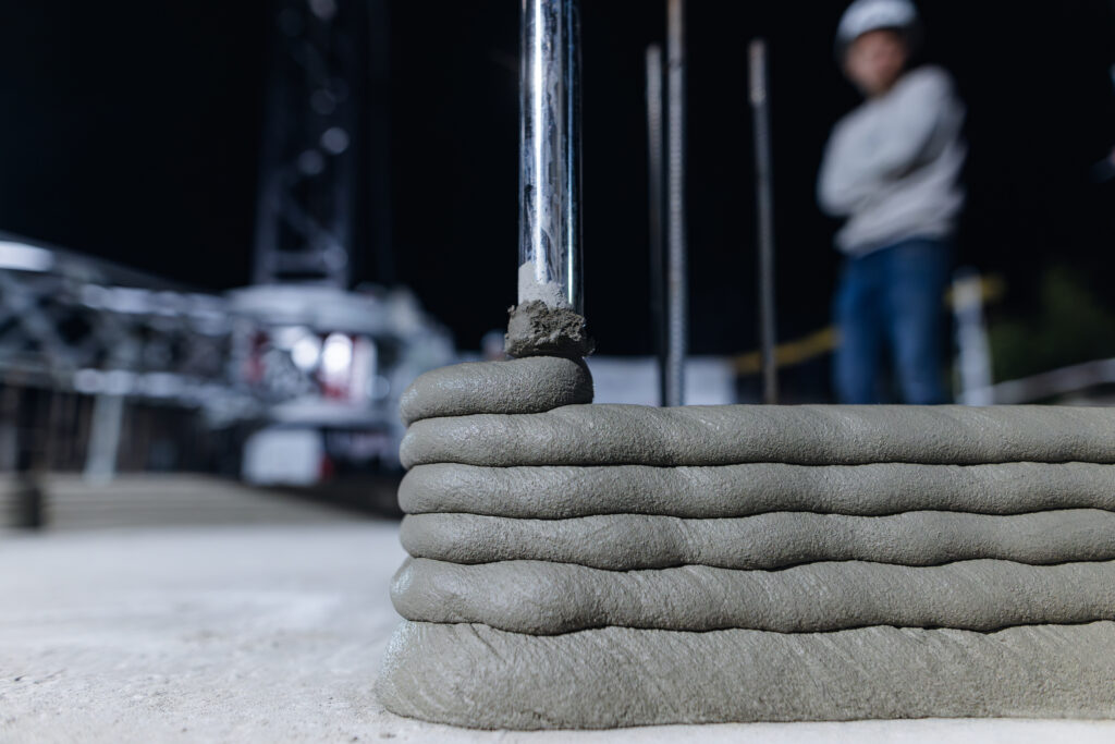 Modern construction of 3D concrete houses. Printed house using a 3D concrete printer