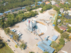 Aerial top view of factory industry. Electricity tower building in energy, transportation, logistic or environment concept. Manufacturing workshop station.