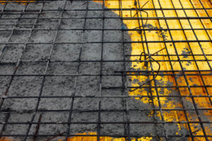 Concrete pouring into reinforcement mesh