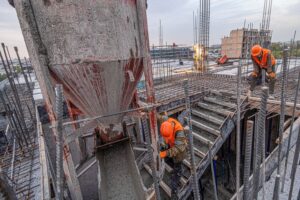 high-angle-shot-of-men-working-on-the-concrete-pour